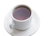 Tea with the Editor A top-down, high-angle view of a white ceramic teacup filled with dark amber tea or black coffee, resting on a matching round white saucer isolated on a plain background.