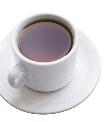 Tea With the Editor A top-down, high-angle view of a white ceramic teacup filled with dark amber tea or black coffee, resting on a matching round white saucer isolated on a plain background.